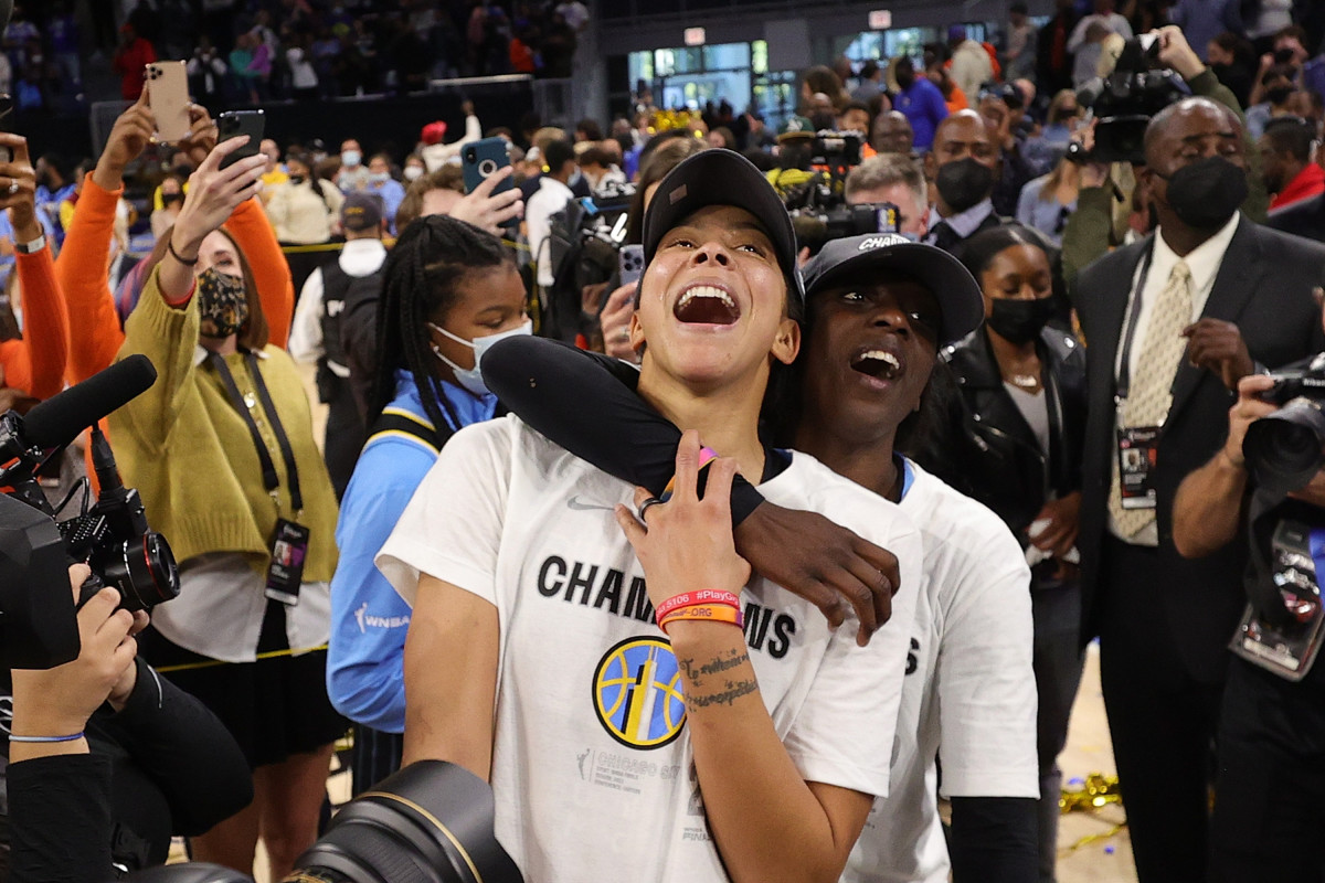 Kahleah Copper hugging Candace Parker from behind